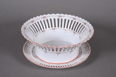 two plates and a bowl on a gray surface