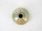 a picture of a ceramic vase with a hole in the center