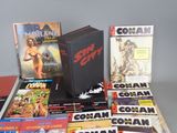a lot of comic books on the table