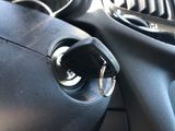 a close up of a car door handle with a key in it