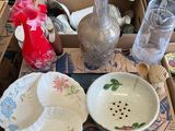 a table with a lot of dishes and bowls on it