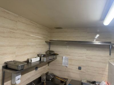 an image of a kitchen with a sink and a stove