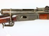 a close up of a rifle on a white surface with a white background