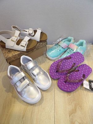 several pairs of shoes that are sitting on a table