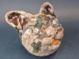 a ceramic animal that is sitting on a table