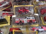 many different types of toy fire trucks in the box
