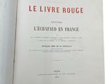 an open book with a red and white title on it