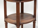 a wooden table with a glass top on a white background