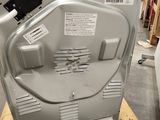 an image of a dishwasher sitting on top of a pallet in a warehouse