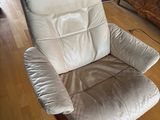 a reclining chair in the middle of a living room