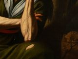 painting of an old woman sitting in a chair with her hand on her chin