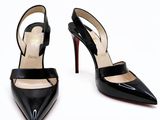 black high heeled shoes with straps on a white background