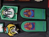 a lot of patches on a black table