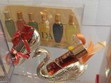 bottles of perfume on display in a glass case in a store