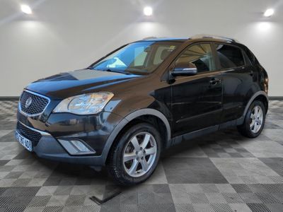 a picture of a black suv parked in a showroom