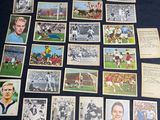 a lot of old football cards on the table