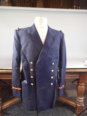 jacket on a mannequin stand on a table in a room
