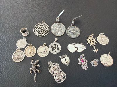 a lot of charms that are sitting on a table
