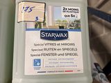 two bottles of starwax sit on top of a wooden pallet