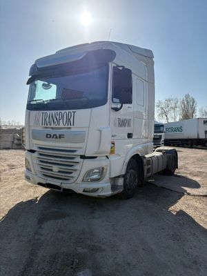 a white truck that is parked in the dirt