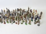 a large group of figurines of various sizes and colors