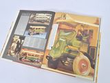 a book with a picture of a man driving a tractor