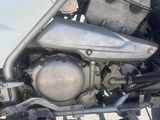 a close up of a motorcycle engine on the ground