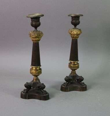 pair of antique brass and bronze candlesticks on marble bases