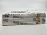 four books stacked on top of each other on a white surface