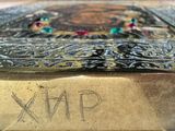 a close up of a metal box with a picture on it