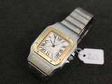 an image of a silver and gold wrist watch with a price tag