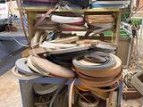 a lot of different types of belts on a cart