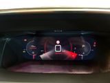 the dashboard of a car with a digital display on it