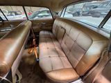 two seats in the back of a car that is dirty