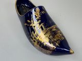 an image of a clogger with a gold and blue design on it