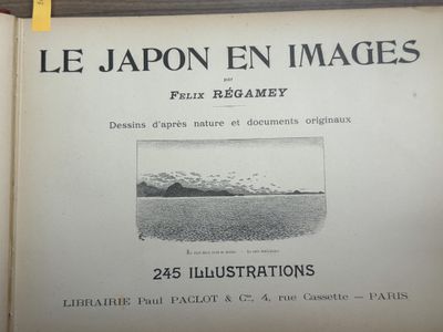 an open book with a picture of a mountain in the background