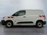 a white van with red stripes parked in a parking lot