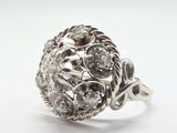 an image of a ring with a cluster of diamonds on it