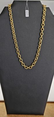 a black mannequin with a gold chain on it