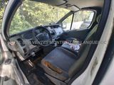 the interior of a car with the door open and the driver ' s seat down