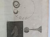 someone is holding a book with a drawing of an object on it