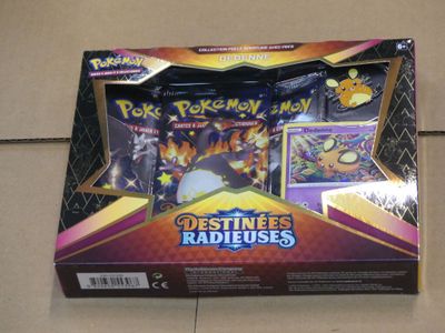 the box of the pokemon card game is open and ready to be played