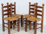 three wooden chairs with wooden seats and a wooden seat on a white floor
