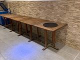 a long wooden table in the middle of a room