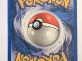 the pokemon trading card is on display on a white surface