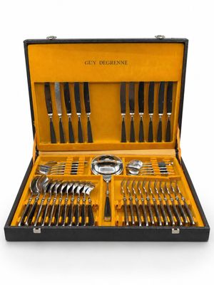 an image of a black case with silverware in it