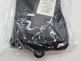 a black cell phone in a plastic bag on a table