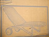 a cardboard box with a picture of a lounge chair on it
