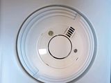 a picture of a smoke detector on a wall