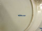 a close up of a plate with a name on it